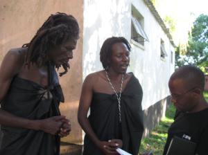 Japhet Matamba interview with a Malawian journalist while drummer James Kamhaka looks on. Photo By Nhau Mangirazi